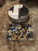 12” round mirrored footed dresser tray and large quantity of brooches, shoe clips for crafting