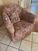Orange and red toned Southwest style swivel padded armchair