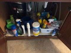 Kitchen utensils, plastic storage containers, cleaning supplies “E” cupboards
