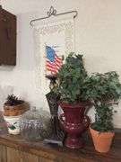 On ledge includes Jones Soda Co Seattle Seahawks collector pack, Easter tree, planters, hurricane shades, etc