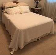 Full size bed with walnut headboard, mattress and box spring LINENS INCLUDED