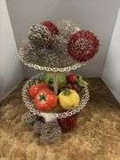 Decorative stand with wire balls and ceramic fruit