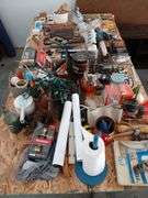 4 x 8 sheet of plywood full of tools and household maintenence items