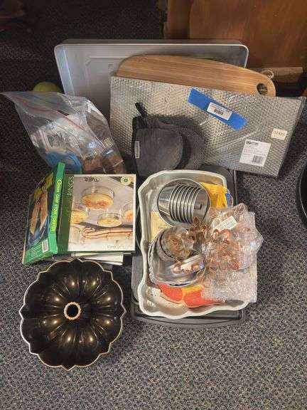 Kitchenwares including baking pans, cutting boards, cookie cutters, Bundt pan, English muffin rings image
