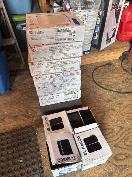 Six boxes of white 12'" x 12” tiles and four boxes of New York glossy black 2" x 6” tiles image