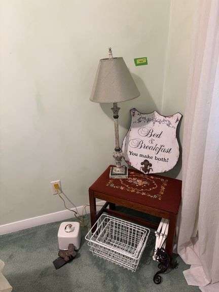 Needlepoint bench, table lamp, wall decor, decorative metal baskets, etc image