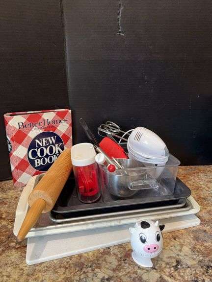 Hand mixer, pans, cutting board,  rolling pin, cookbooks, timer image