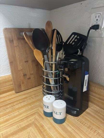 Electric can opener, kitchen utensils, salt and pepper, cutting board, coffee mugs, ice cream sign image