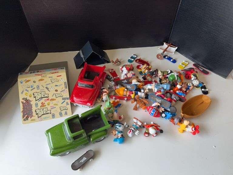 Box of Tech Deck dudes and a box of Mighty Beanz image