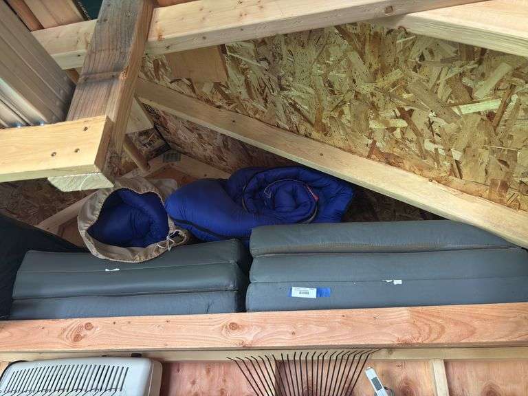Two fold up sleeping cushions and two sleeping bags image