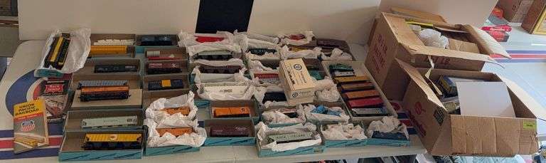 3 boxes of HO train misc and a table full of HO Scale train cars image