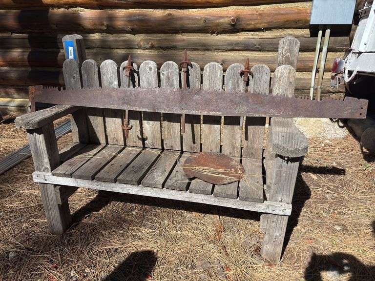 Wooden bench with sawblade and spikes image