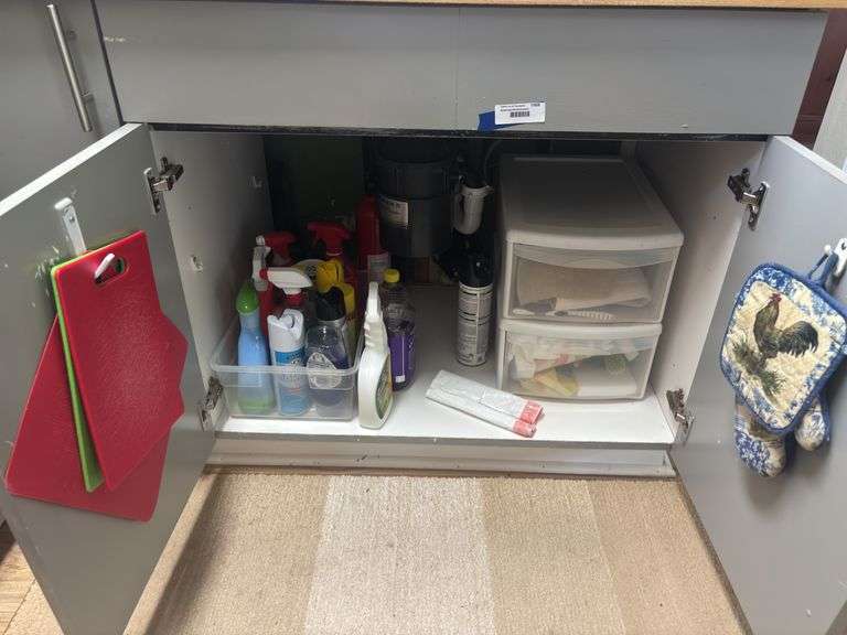 Cleaning supplies, storage container, dish towels, cutting boards image