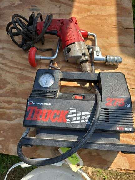 Hand drill, interdynamics Truck Air 275 psi portable compressor and Milwaukee magnum hole shooter image
