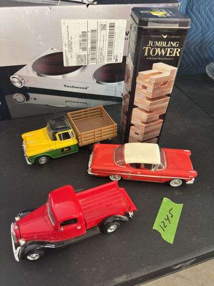 Three diecast cars, and Jenga blocks image