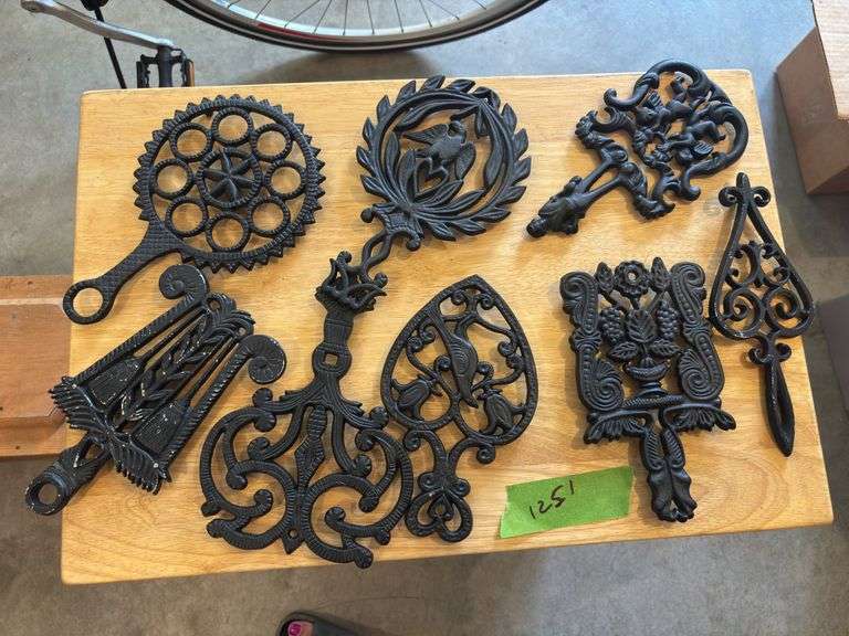 Eight cast iron vintage trivets image