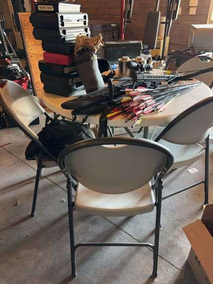 45” round folding table and 5 folding chairs -no contents included image