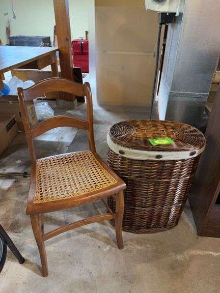 Three laundry baskets and cane seat chair image