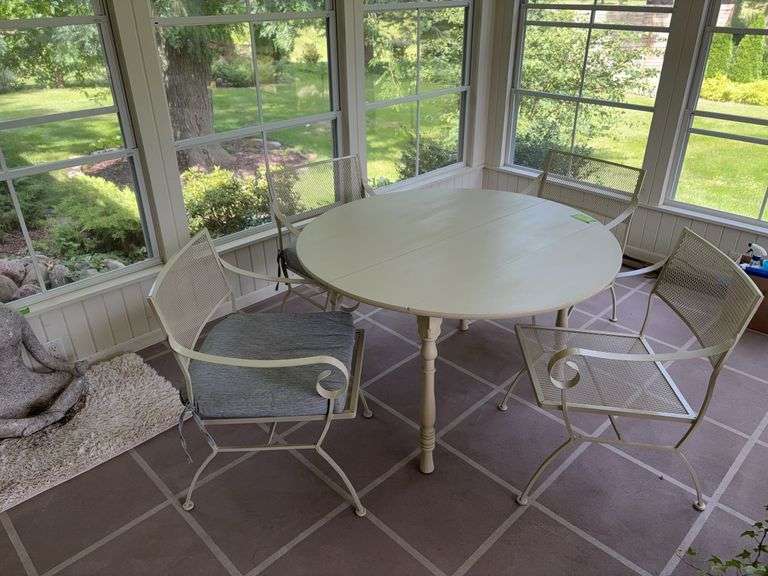 47” round white painted wood table and 4 expanded metal chairs image