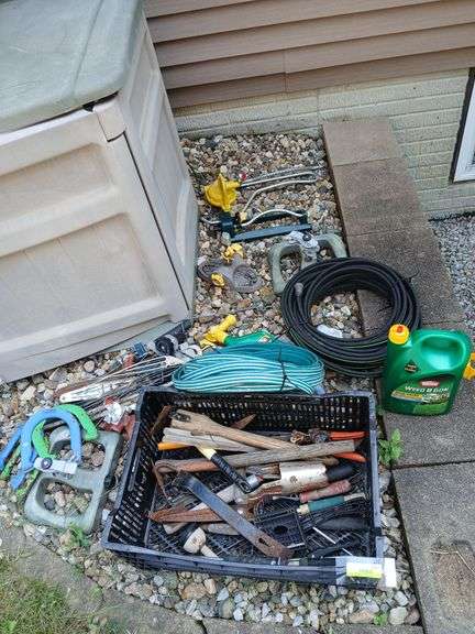 Yard tools, garden hoses, sprinklers, horse shoes etc... image