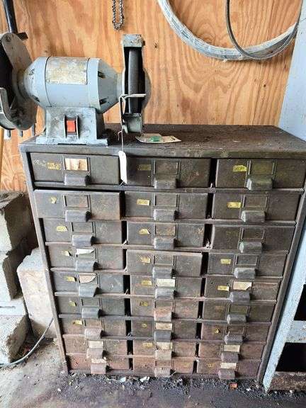 27 drawer metal cabinet with contents and bench grinder image