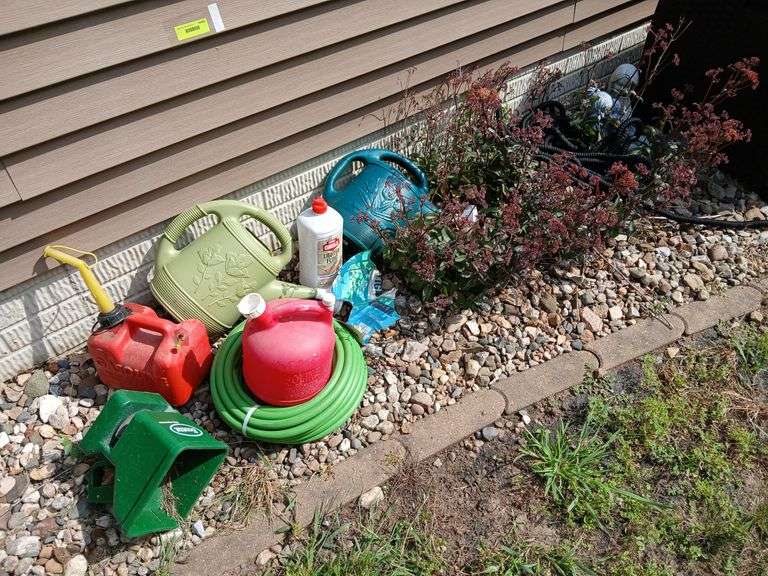 Watering cans, garden hoses, gas cans etc... image