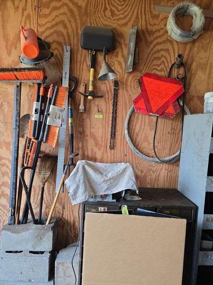 Hazard signs, wire, chainsaw chains, scraper, push brooms, etc image
