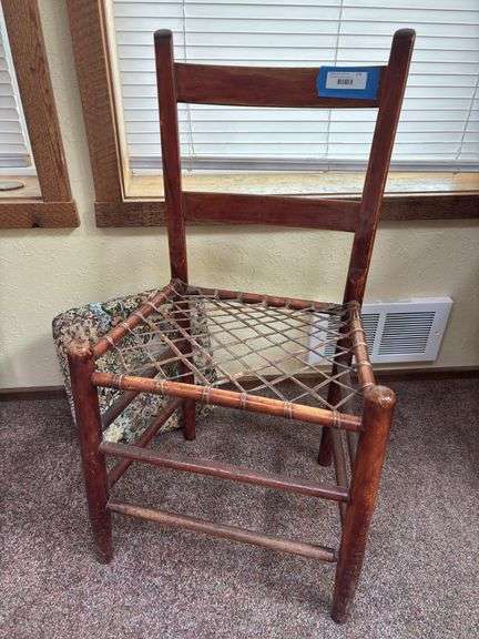 Antique chair with rawhide woven seat image
