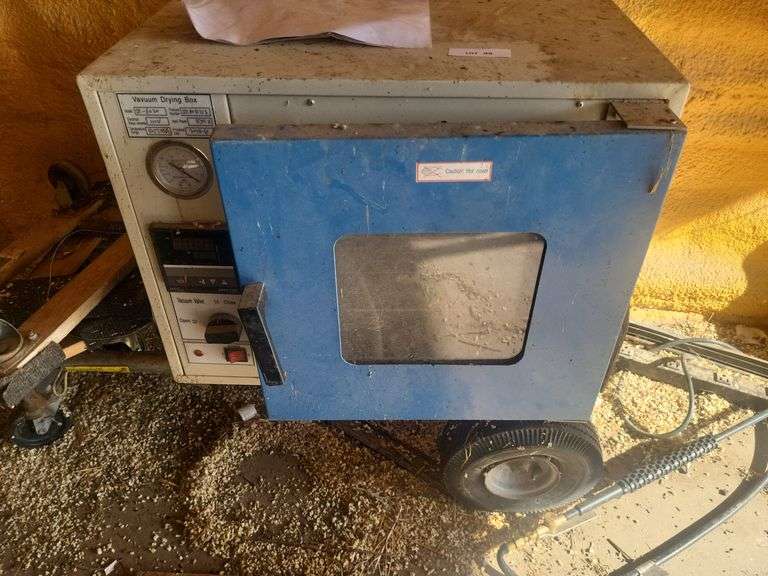 Vacuum drying box on hand cart image