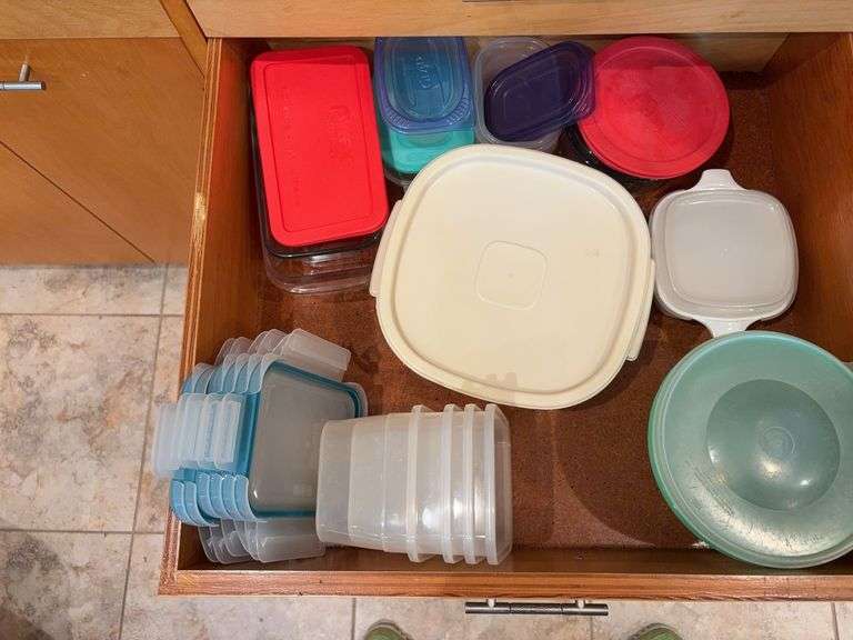 Drawer full of storage containers including Tupperware & Pyrex “F” drawer image