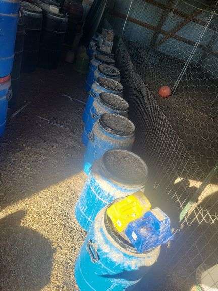 Blue feed barrels with lids (we recommend wearing mask and gloves to remove this item) image