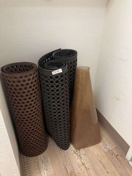 3 Rubber floor mats, one plastic image