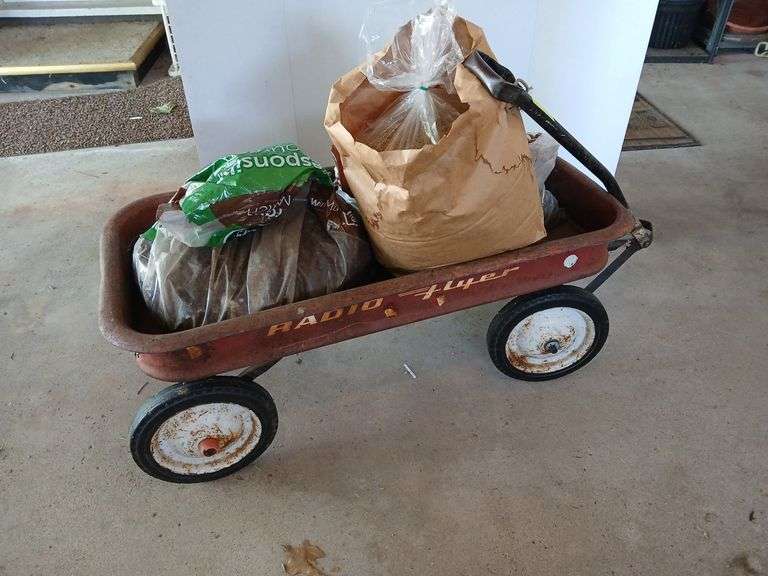 Old Radio Flyer coaster wagon and dirt image