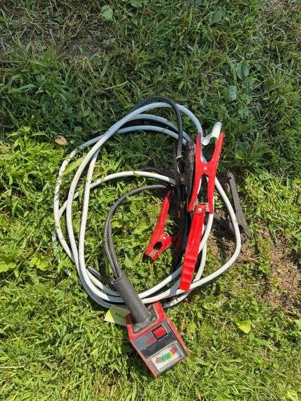 Pair of jumper cables and 12V battery tester image