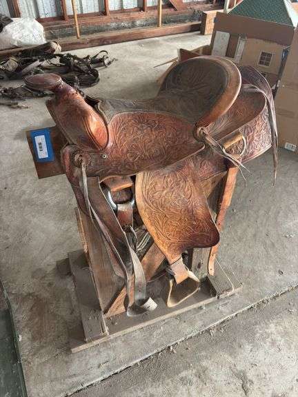 Small Tooled leather saddle - needs conditioning image