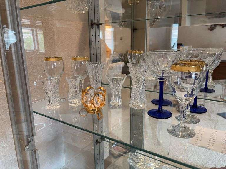 Blue stem, martini, glasses, gold rimmed wine, glasses, various small vases image