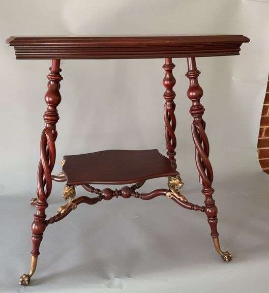 Mahogany twisted leg table w brass claw feet and lion head accents 18.5 x 26.5 x 28H image