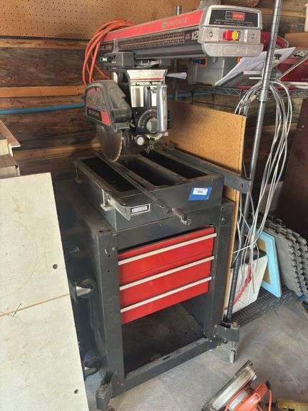 220V Craftsman 12 inch radial arm saw on roller stand with wheels and toolbox drawer storage image