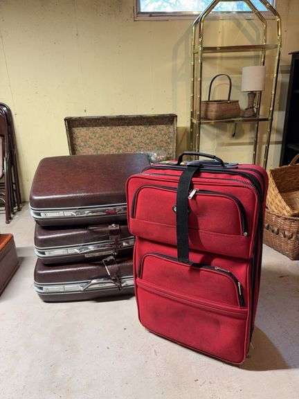 Large rolling suitcase and matched set of 3 hard sided suitcases image