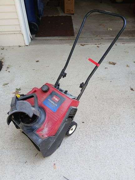 Toro Powerlite 16" snowblower and gas can image