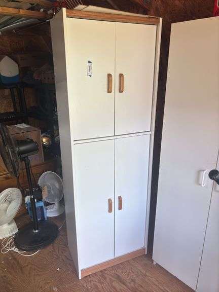 Storage cupboard and contents image