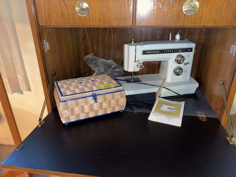 Kenmore sewing machine Model 1625 and sewing basket with notions image