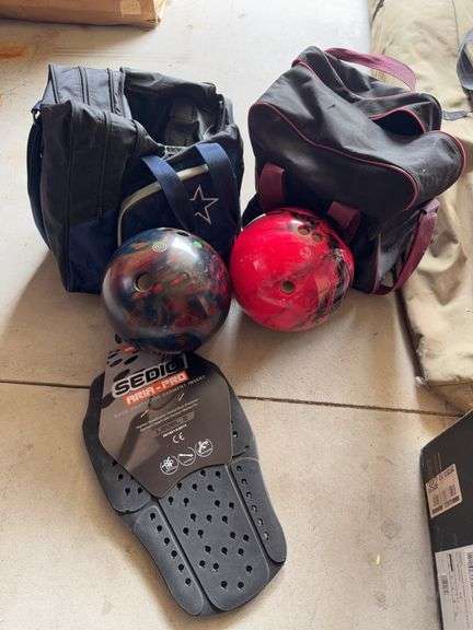 2 bowling balls and bags image