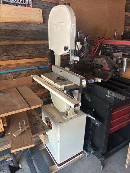 Jet woodworking bandsaw on stand with locking roller cart plus extra blade image