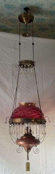 Cranberry prism ring lamp, brass & copper font, three matching rings, clear glass prisms, smoke bell, retractable cord reel image