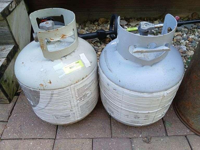 2 grill LP tanks (1) 1/2 full, 1 empty image