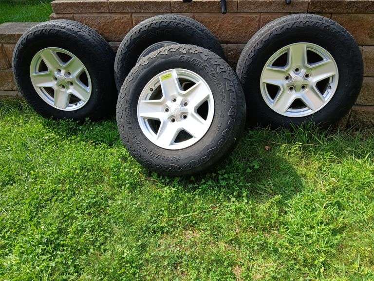 Set of 4 Bridgestone Dueller 245/75R17 tires on Jeep rims image