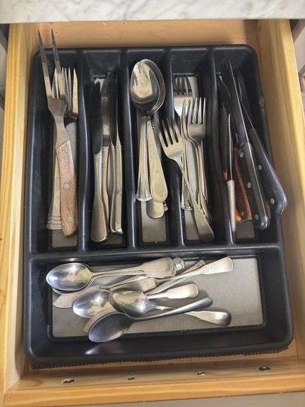 Small set of flatware and steak knives image
