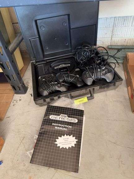 Sega Genesis with three controllers image