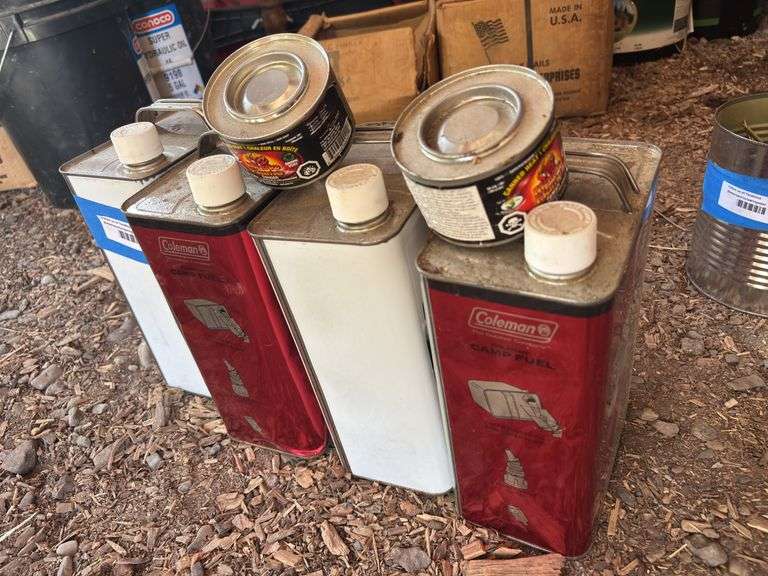 Four cans of camp fuel and two sterno fuels image